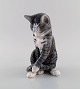 Erik Nielsen for Royal Copenhagen. Porcelain figure. Grey-striped cat. Model 
number 1025/340. Dated 1950.
