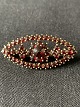Silver brooch 
from HGR with 
garnets.
Length: 3.6 cm