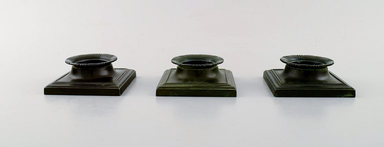 Just Andersen (1884-1943). Three art deco candle holders in disko metal. Model 
number: 1802.

