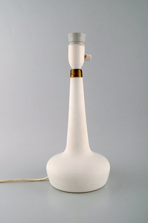 Holmegaard table lamp in white art glass with brass mounting. Danish design, 
1960