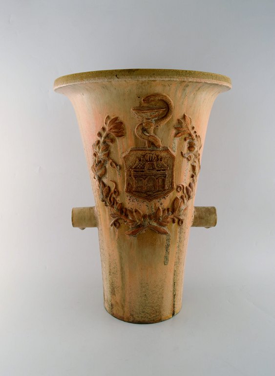 Colossal Arne Bang unique vase in glazed ceramics with brand from pharmacy in 
Aalborg, Denmark. Dated 1933. Decorated with Rod of Asclepius as a symbol of 
medicine.
