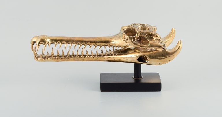 Unknown French sculptor. Large sculpture in gilded metal - modern design in the 
shape of a crocodile skull.