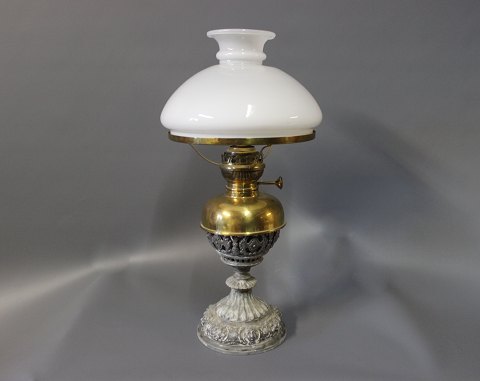 Kerosene table lamp with an iron/brass foot and White glass dome.
5000m2 showroom.
