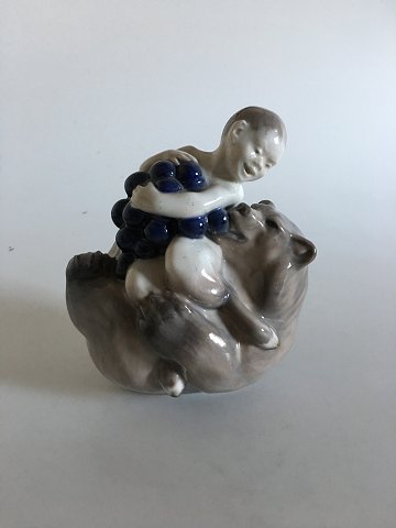 Royal Copenhagen Figurine of Faun with Grapes Sitting on a Bear No 2318