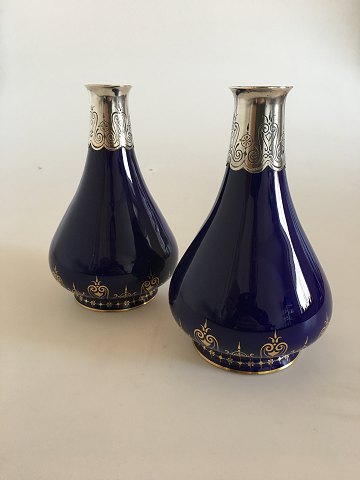 A pair of Sevres Vases with Silver Mountings