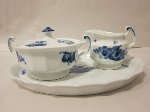 Royal Copenhagen, Blue Flower, Angular
Sugar basin with a lid, cream jug and tray
It is possible to buy singly or special offer when all pieces are bought as one 
purchase
We have a good choice of Blue Flower
Please contact us for further information