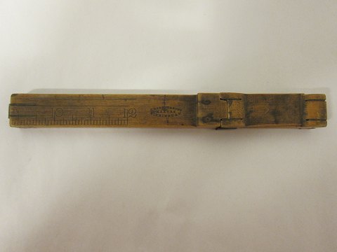 Tool for measuring the feet
An old collapsible tool, used by the shoemaker for measuring the lenght of the 
feet, to find the correct size of the shoe.
Made of brass and wood
Stamp: J.Rabone & Sons, Makers, Birmingham
L: 23cm (in the shortest size)