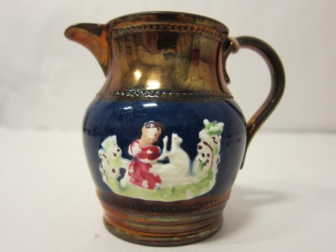 Lustre jug with a beautiful painting
H: 9cm