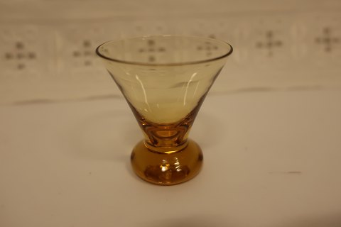 Glass, amber colour
Good small glasses