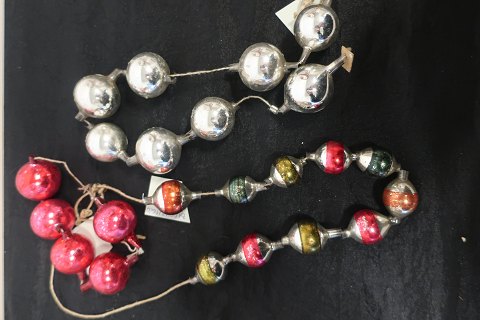 Old, special Christmas decoration
A row of glass pellets / balls with holes in boths ends