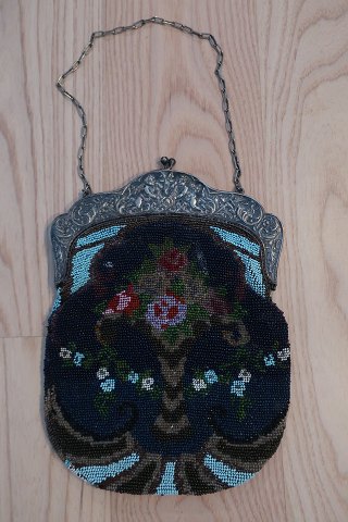 Handmade bag, made of glass beads
This beautiful old handmade bag, from about 1880, is handmade of glass beads 
with embroidery which shows creative figures
The shape is with a beautiful closing at the top made of metal which is 
silver-plated