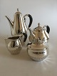 Danam Antik 
presents: 
Georg 
Jensen Sterling 
Silver Cosmos 
Coffee and Tea 
Pot with 
Creamer & Sugar 
No 45