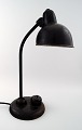 Christian Dell: f. Offenbach am Main in 1893, d. Wiesbaden 1974th
Industrial Bauhaus table lamp in black lacquered metal with adjustable shade.
Marked Original Kaiser Idell.