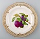 Royal Copenhagen Flora Danica pierced dinner plate with fruit motif. Plum.