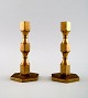 Gusum metal, a pair of candlesticks in brass.
