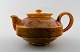 Kähler, Denmark, glazed stoneware teapot in uranium yellow glaze.
Stamped. 1940s.
