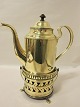 Coffee pot made of brass incl. the lower part
About 1830
H pot: 20cm, Diam: 11cm
H the lower part: 10cm, Diam: 13cm
