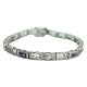 A diamond bracelet mounted in 14k white gold set with diamonds and sapphires