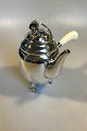 Danam Antik 
presents: 
Georg 
Jensen Sterling 
Silver Blossom 
Coffee Pot with 
Ivory Handle 
No. 2D
