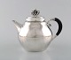 L'Art presents: 
Rare Georg 
Jensen teapot 
in sterling 
silver with 
ebony handle. 
Dated 1915-30.
