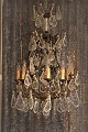 K&Co. presents: 
Big old 
crystal 
chandelier from 
the early 1900s 
with lots of 
large leaf 
shaped glass 
...
