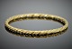 Antik 
Damgaard-
Lauritsen 
presents: 
Georg 
Jensen; A 
braided bangle 
of 18k gold 
#1017A