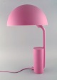 KaschKasch for Normann Copenhagen. Cap table lamp in pink lacquered steel with 
adjustable lampshade. 21st Century.
