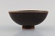 Berndt Friberg (1899-1981) for Gustavsberg Studiohand. Bowl on foot in glazed 
stoneware. Beautiful glaze in brown shades. Dated 1968.
