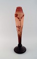 L'Art presents: 
Daum 
Nancy, France. 
Large "Tobacco 
flowers" 
multilayer 
glass vase with 
an etched decor 
of red ...