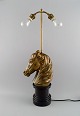 La Maison Charles, France. Large horse head table lamp in brass. Mid-20th 
century.
