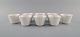 Wilhelm Kåge for Gustavsberg. Eight cups in white glazed porcelain. Swedish 
design, 1960s.
