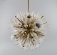 L'Art presents: 
Emil 
Stejnar for 
Rupert Nikoll. 
Impressive 
ceiling lamp in 
brass and art 
glass shaped 
like ...