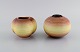 Gertrud Lönegren (1905–1970) for Rörstrand. Two round vases in glazed ceramics. 
Beautiful peach glaze. 1930s / 40s.
