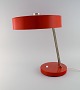 Large adjustable desk lamp in original red lacquer. 1970