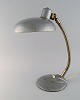 Adjustable desk lamp in original metallic lacquer. Industrial design, mid 20th 
century.
