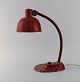 Adjustable work lamp in original red lacquer. Industrial design, mid 20th 
century.
