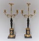 Lundin Antique 
presents: 
Empire 
bronze 
Candlesticks. 
Probably French 
about 1810. A 
pair. Height 48 
cm.