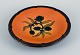 Ipsens, Denmark, ceramic bowl with floral motif.
Glaze in orange-green shades.
