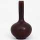 Roxy Klassik 
presents: 
Axel Salto 
/ Royal 
Copenhagen
High-necked 
vase in 
stoneware with 
oxblood glaze. 
Model ...