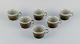 Marianne Westman for Rörstrand, "Maya", a set of six coffee cups in stoneware 
with green-brown glaze.