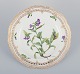 Royal Copenhagen Flora Danica, open lace lunch plate. Latin text. Decorated 
outside the factory.