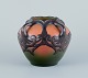 Ipsens, Denmark. Ceramic vase in Art Nouveau style.
Design depicting plant growth. Glaze in orange and green tones.
