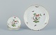 Herend, Hungary. Set of four porcelain bowls hand-painted with butterflies and 
birds on branches. Gold rim.