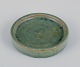Arne Bang, own workshop. Small ceramic dish decorated in blue-green glaze. 
Handmade.