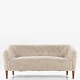 Roxy Klassik 
presents: 
Ludvig 
Pontoppidan
Overstuffed 
sofa in new 
lambskin 
(colour: 
Moonlight) with 
legs in ...