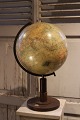 Decorative, old globe in papier mache with a fine patina on a wooden base with a 
compass at the bottom...