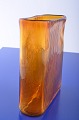Amber colored 
glass vase