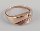 L'Art presents: 
Danish 8 
karat gold 
ring.
Adorned with a 
brilliant-cut 
diamond.