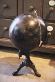 K&Co. presents: 
Decorative, 
antique globe 
in black on an 
iron base for 
teaching stars 
and planets...