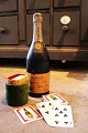 K&Co. presents: 
Decorative, 
old wooden 
champagne 
bottle with 2 
sets of 
champagne 
playing cards 
hidden 
inside...